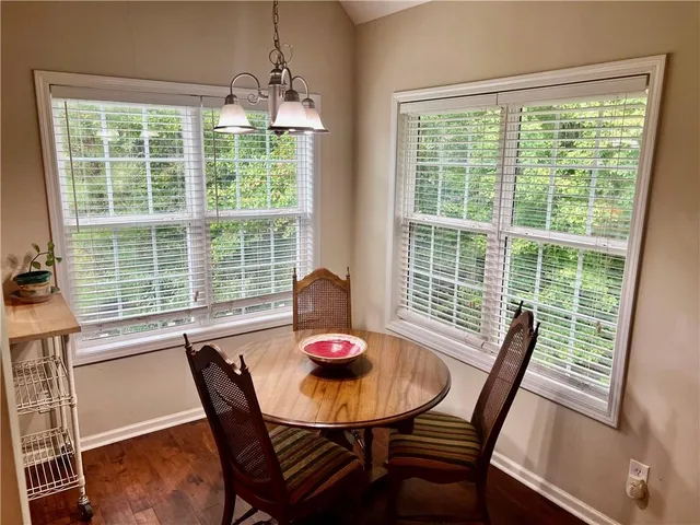 a view of a dining room with furniture window and outside view