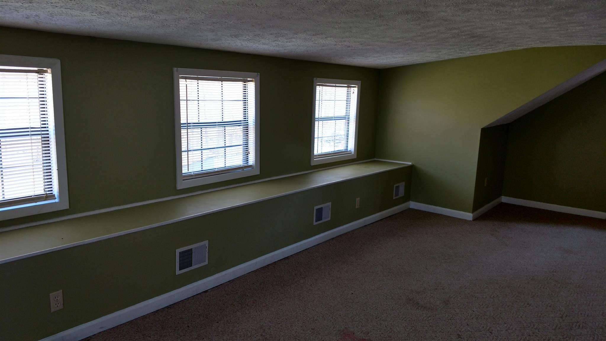 128 Butler Road Portland, TN 37148 - Photo 11 of 13 a room with two windows and a night stand