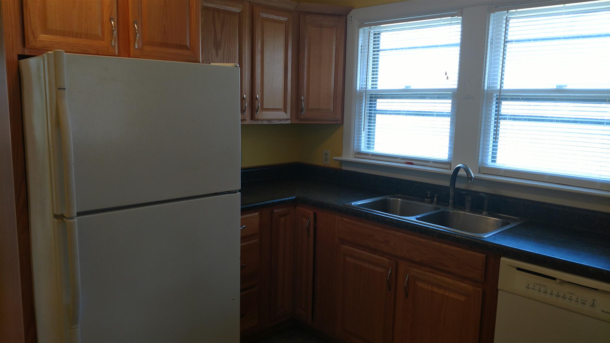 128 Butler Road Portland, TN 37148 - Photo 8 of 13 a kitchen with a refrigerator and a sink