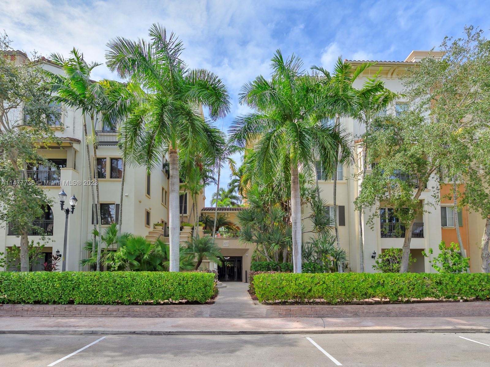 Artesia Sunrise, FL 33323 - Photo 2 of 38 a view of a white house with a yard and palm trees