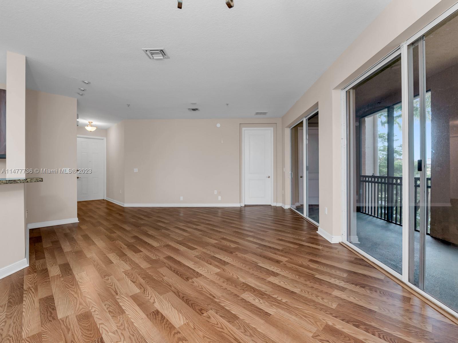 Artesia Sunrise, FL 33323 - Photo 29 of 38 a view of empty room with wooden floor
