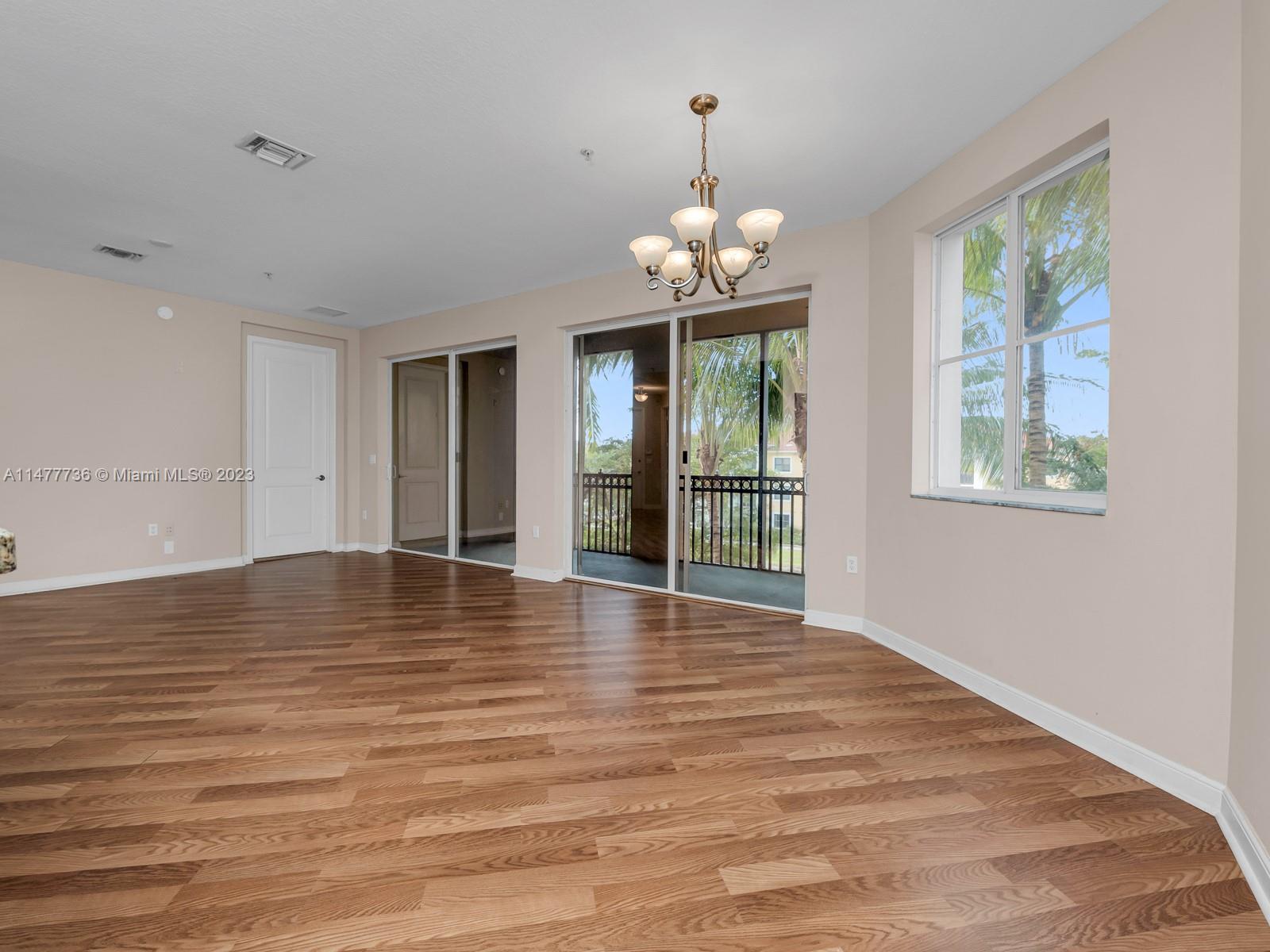 Artesia Sunrise, FL 33323 - Photo 34 of 38 a view of empty room with wooden floor and fan