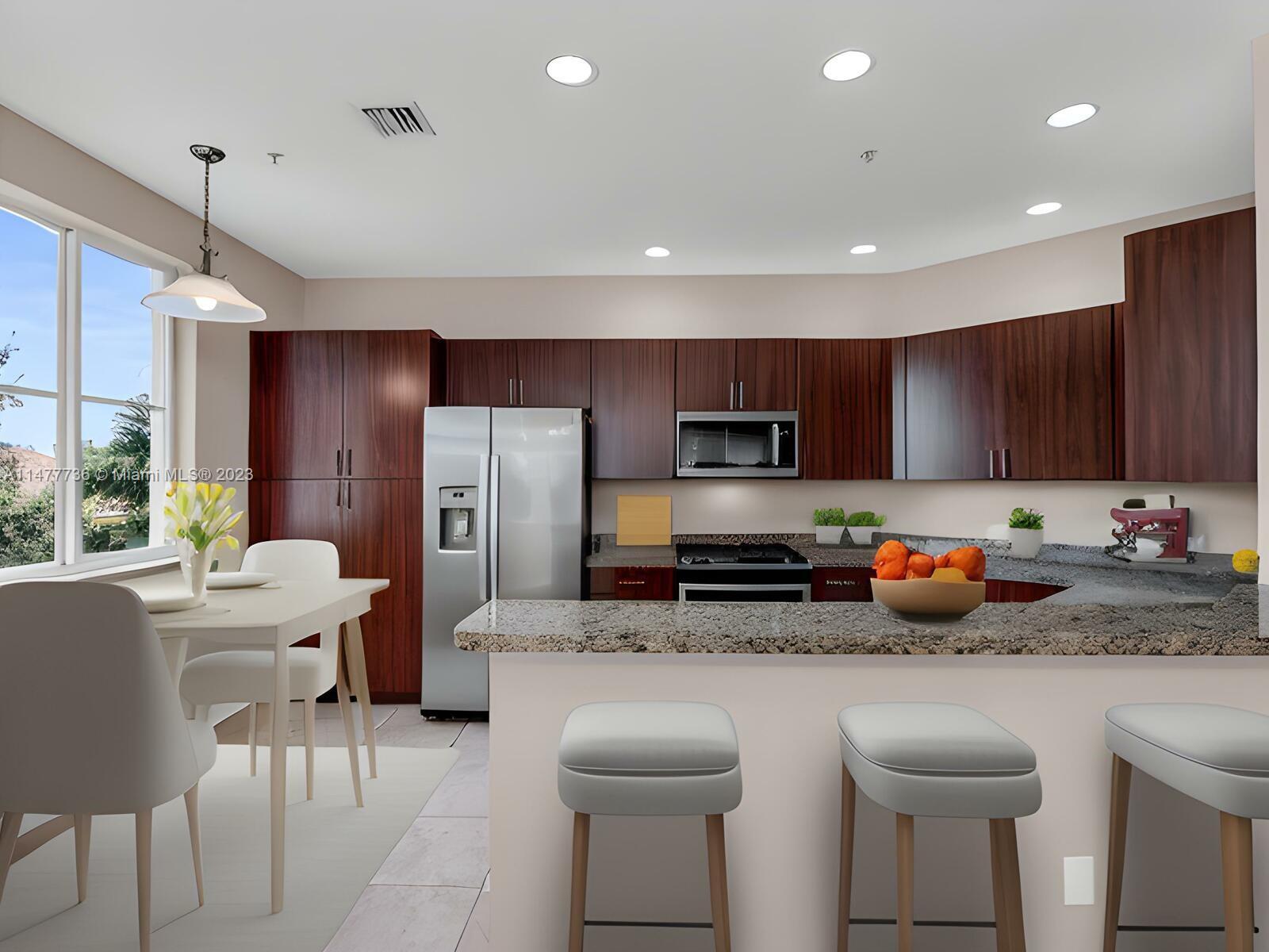 Artesia Sunrise, FL 33323 - Photo 5 of 38 a kitchen with stainless steel appliances granite countertop a sink refrigerator stove and microwave