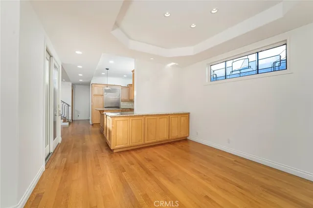 a view of kitchen with wooden floor