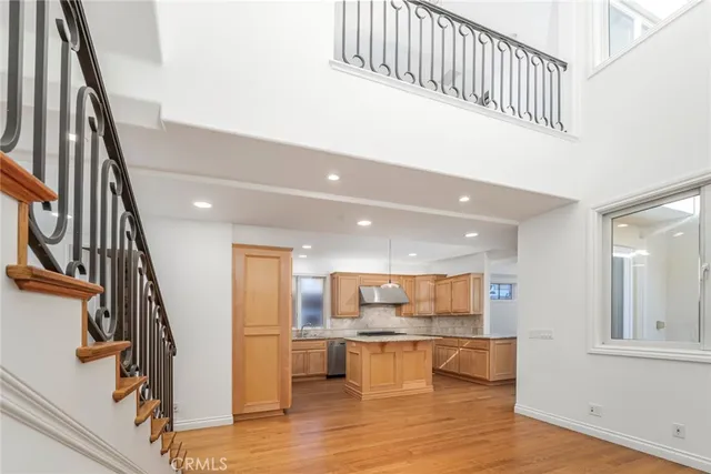 a view of kitchen with wooden floor and electronic appliances