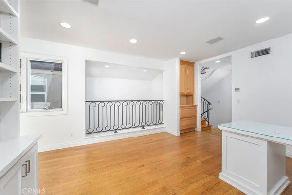 a view of livingroom with hardwood floor and staircase