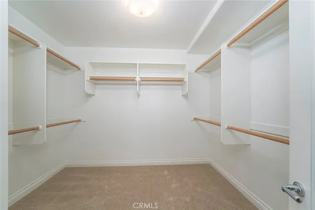 a view of an empty walk in closet
