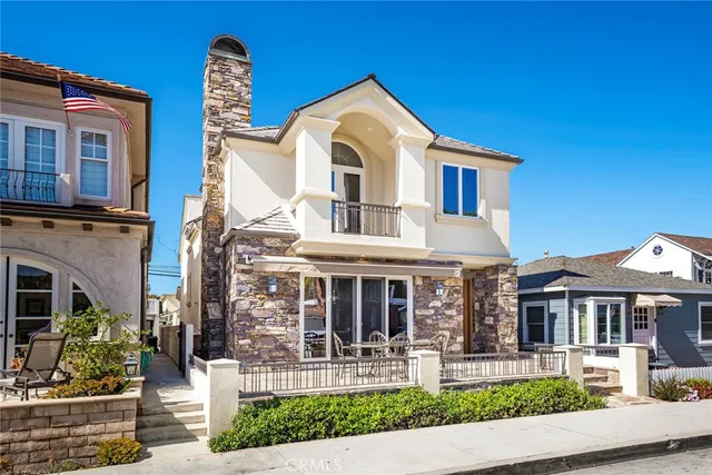 a front view of a house with garden and porch
