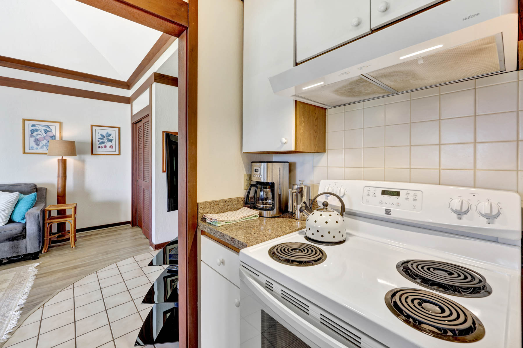 2253 Poipu Road, Unit 138 Koloa, HI 96756 - Photo 14 of 27 a kitchen with a stove and a refrigerator