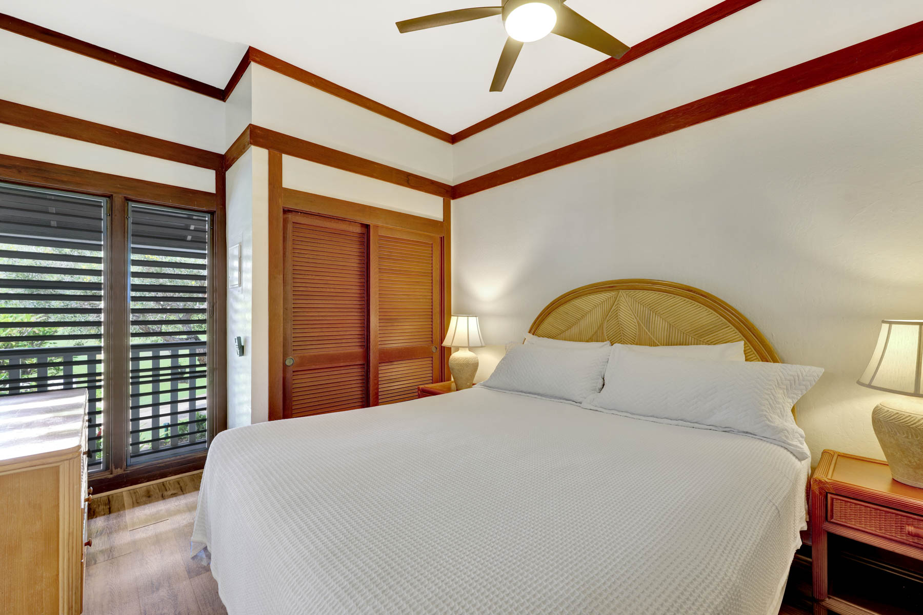 2253 Poipu Road, Unit 138 Koloa, HI 96756 - Photo 16 of 27 a bedroom with a bed and a large window