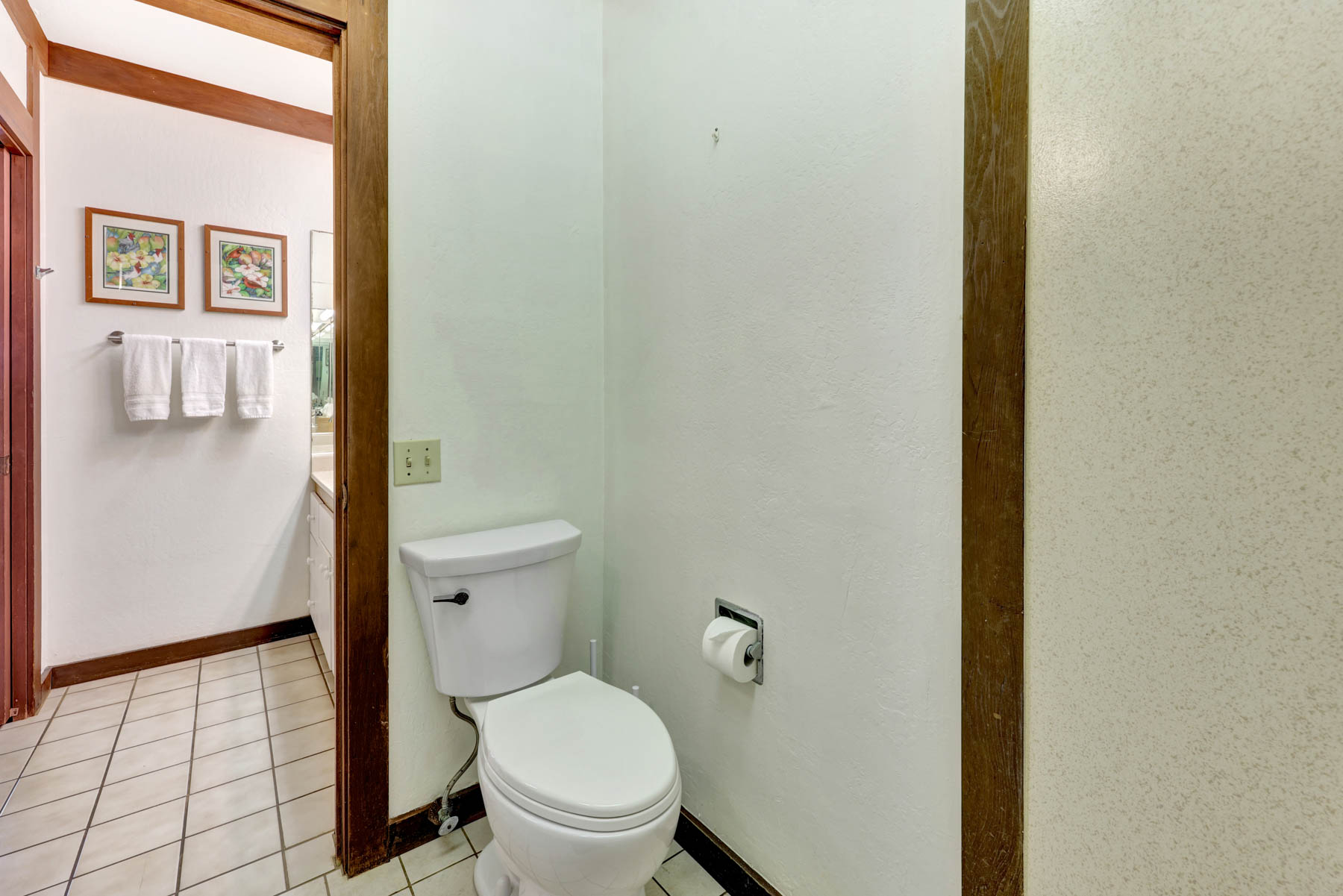 2253 Poipu Road, Unit 138 Koloa, HI 96756 - Photo 25 of 27 a white toilet sitting next to a shower curtain