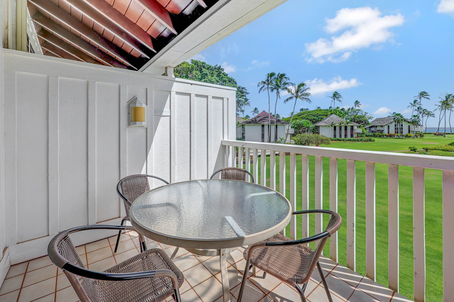 2253 Poipu Road, Unit 138 Koloa, HI 96756 - Photo 3 of 27 a balcony with table and chairs