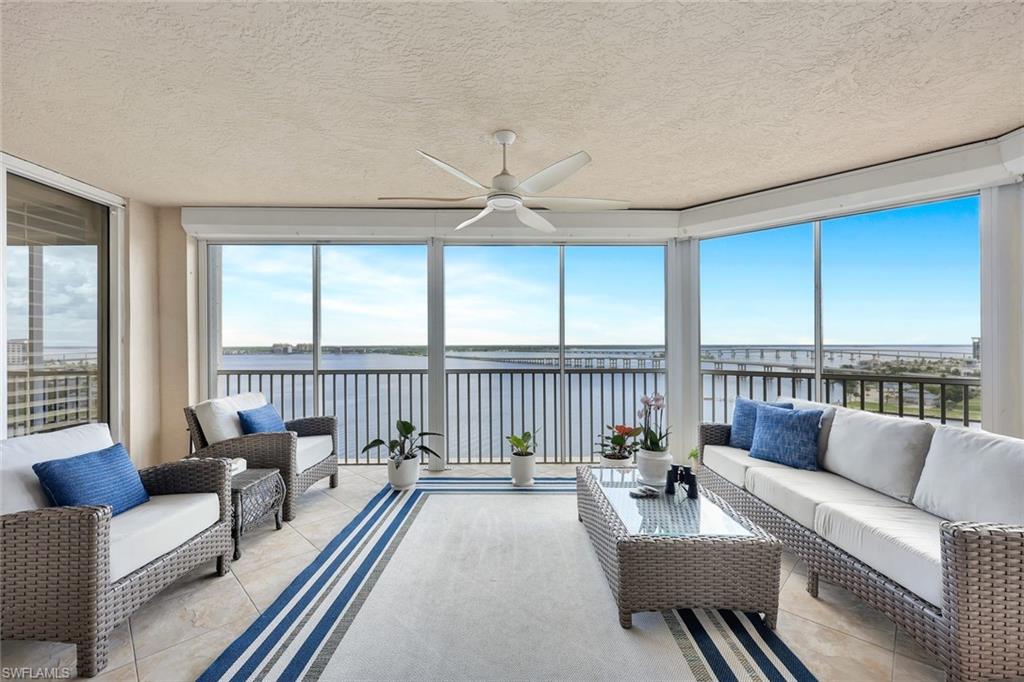 2104 West First Street, Unit 1404 Fort Myers, FL 33901 - Photo 12 of 33 a living room with furniture and a large window