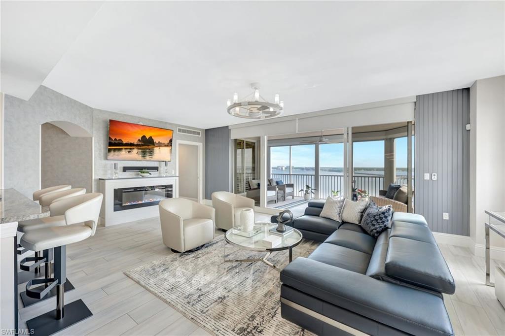 2104 West First Street, Unit 1404 Fort Myers, FL 33901 - Photo 15 of 33 a living room with furniture and a large window