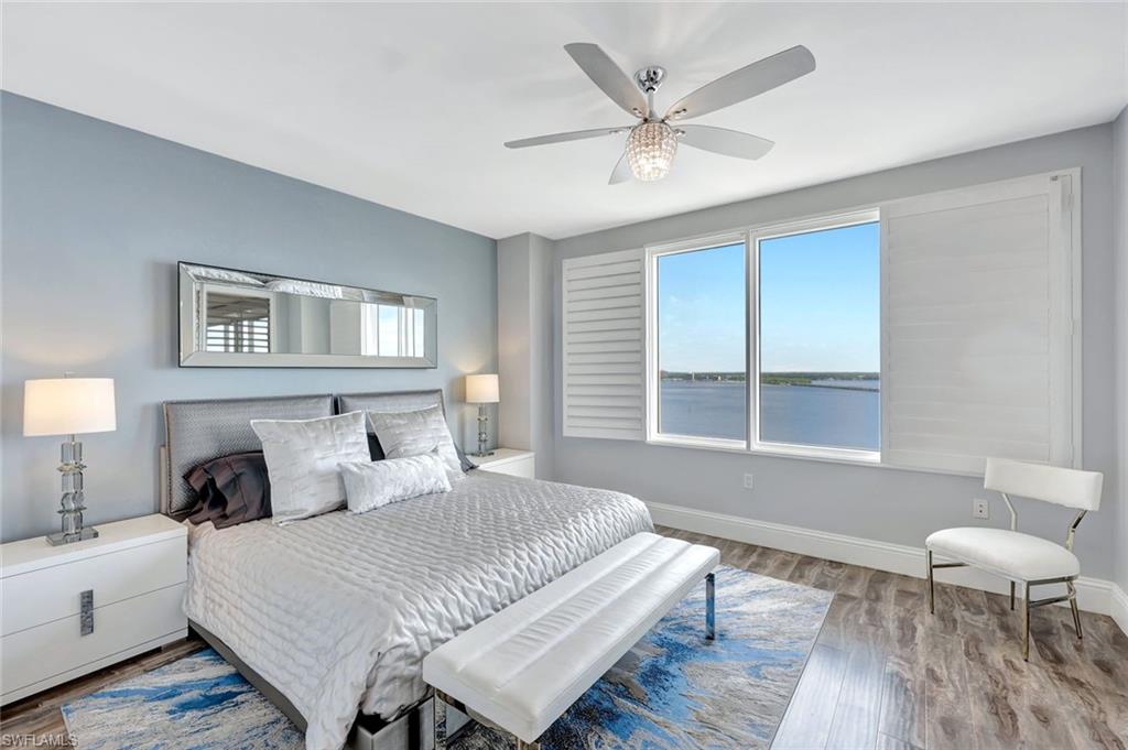 2104 West First Street, Unit 1404 Fort Myers, FL 33901 - Photo 16 of 33 a bedroom with a bed and wooden floor