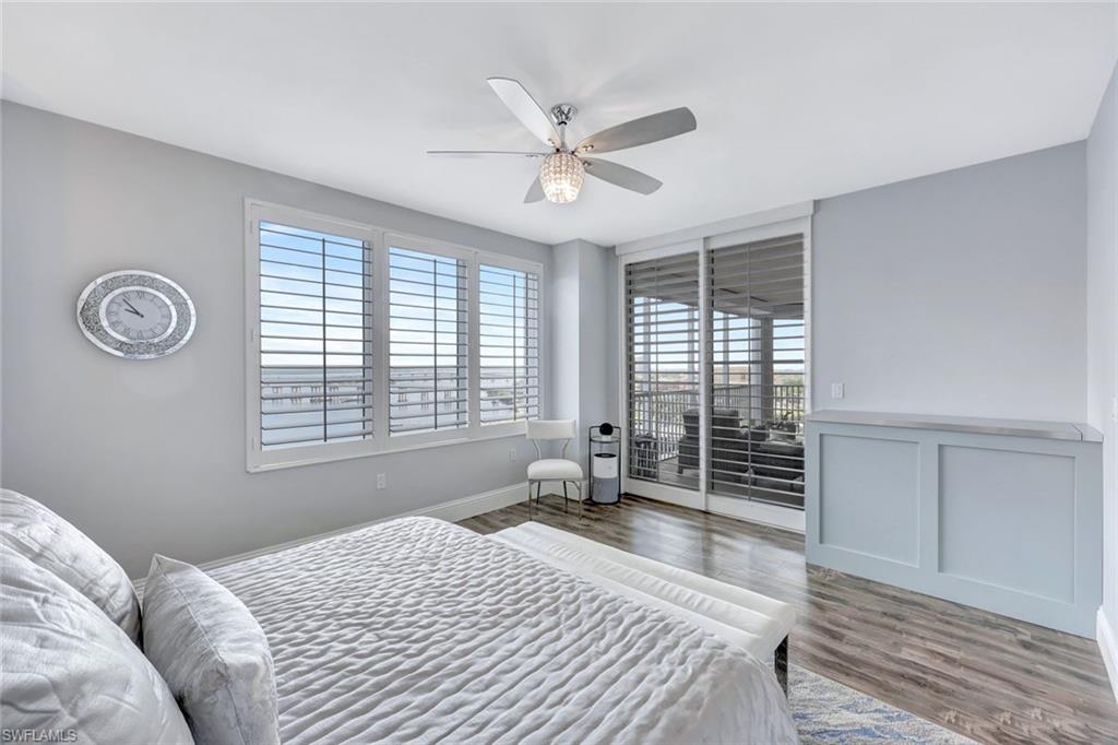 2104 West First Street, Unit 1404 Fort Myers, FL 33901 - Photo 17 of 33 a bedroom with a bed and a large window