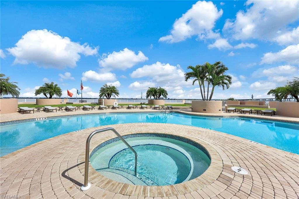 2104 West First Street, Unit 1404 Fort Myers, FL 33901 - Photo 29 of 33 a view of a swimming pool and an outdoor seating