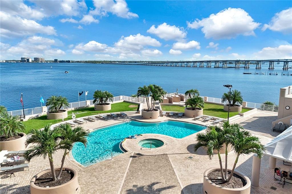 2104 West First Street, Unit 1404 Fort Myers, FL 33901 - Photo 30 of 33 a view of a swimming pool and lounge chairs