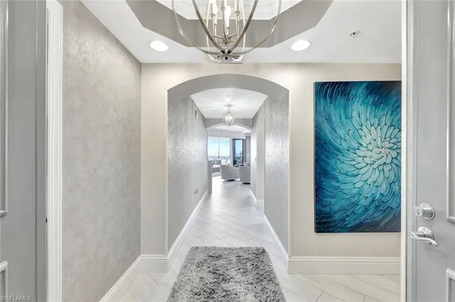 a view of a hallway with a chandelier