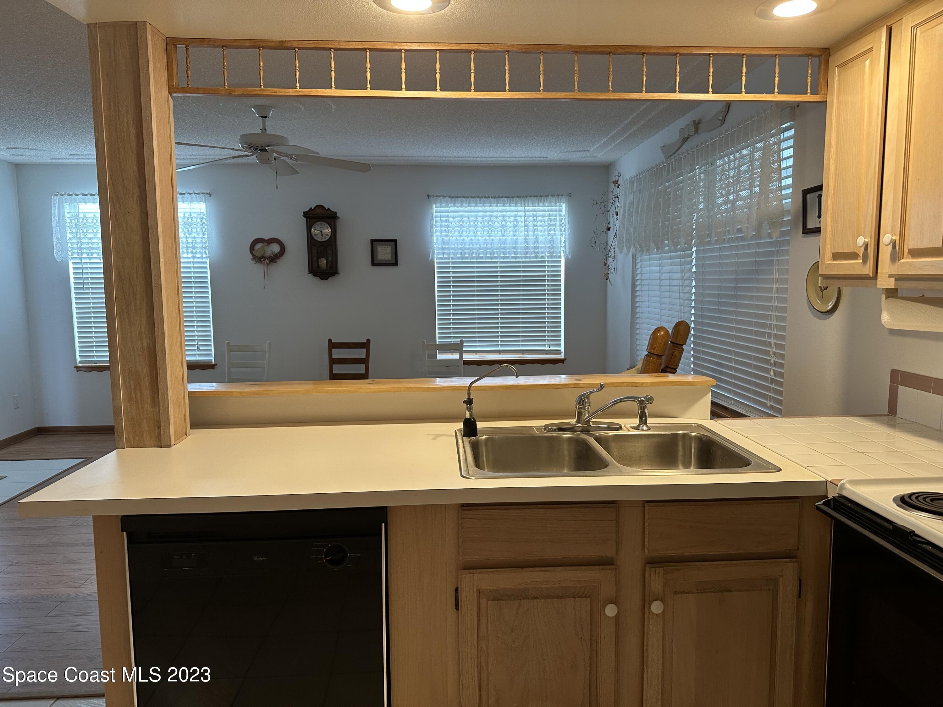 3995 Toby Avenue Malabar, FL 32950 - Photo 13 of 43 a bathroom with a sink and a mirror