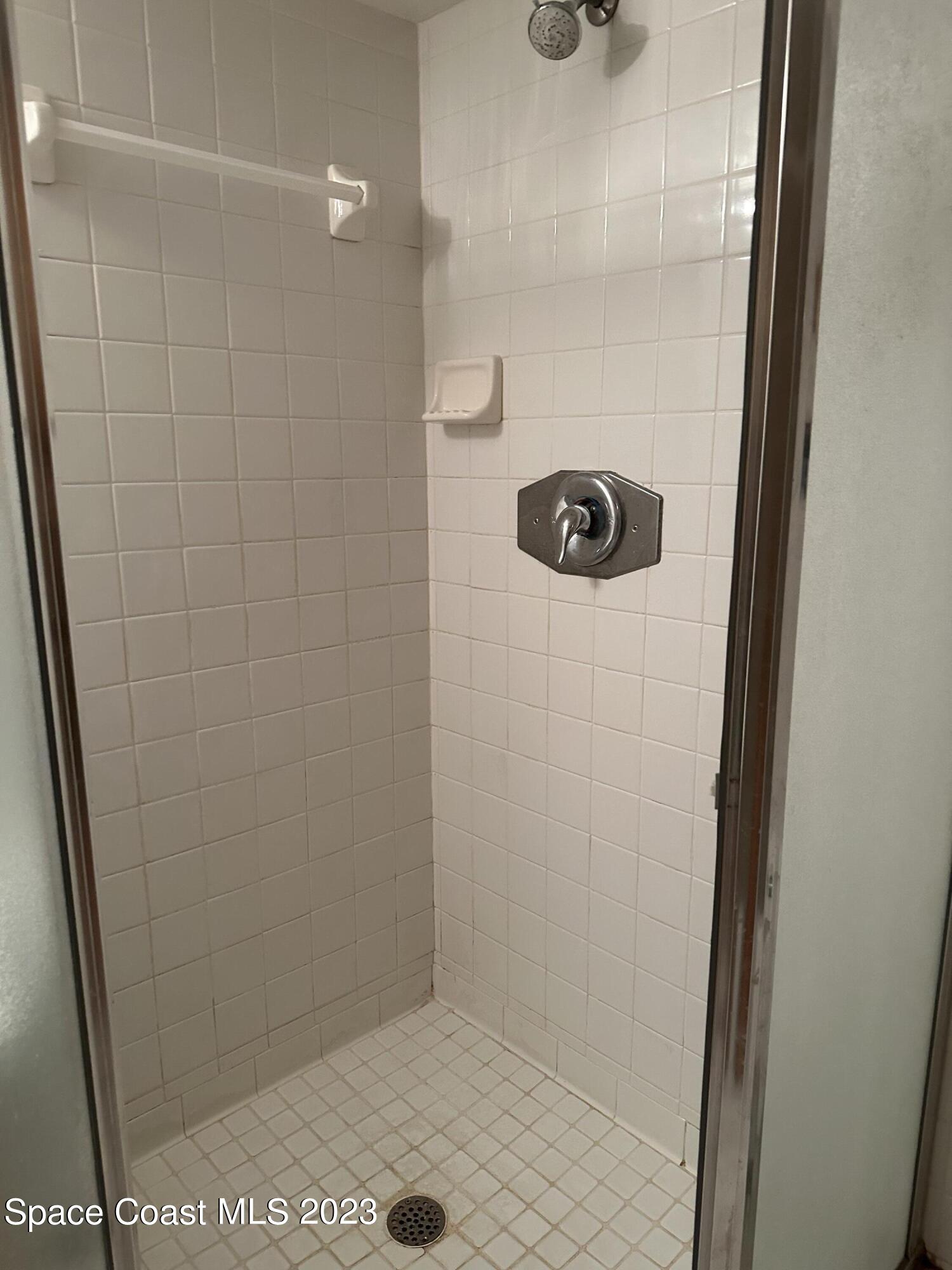 3995 Toby Avenue Malabar, FL 32950 - Photo 23 of 43 a bathroom with a shower