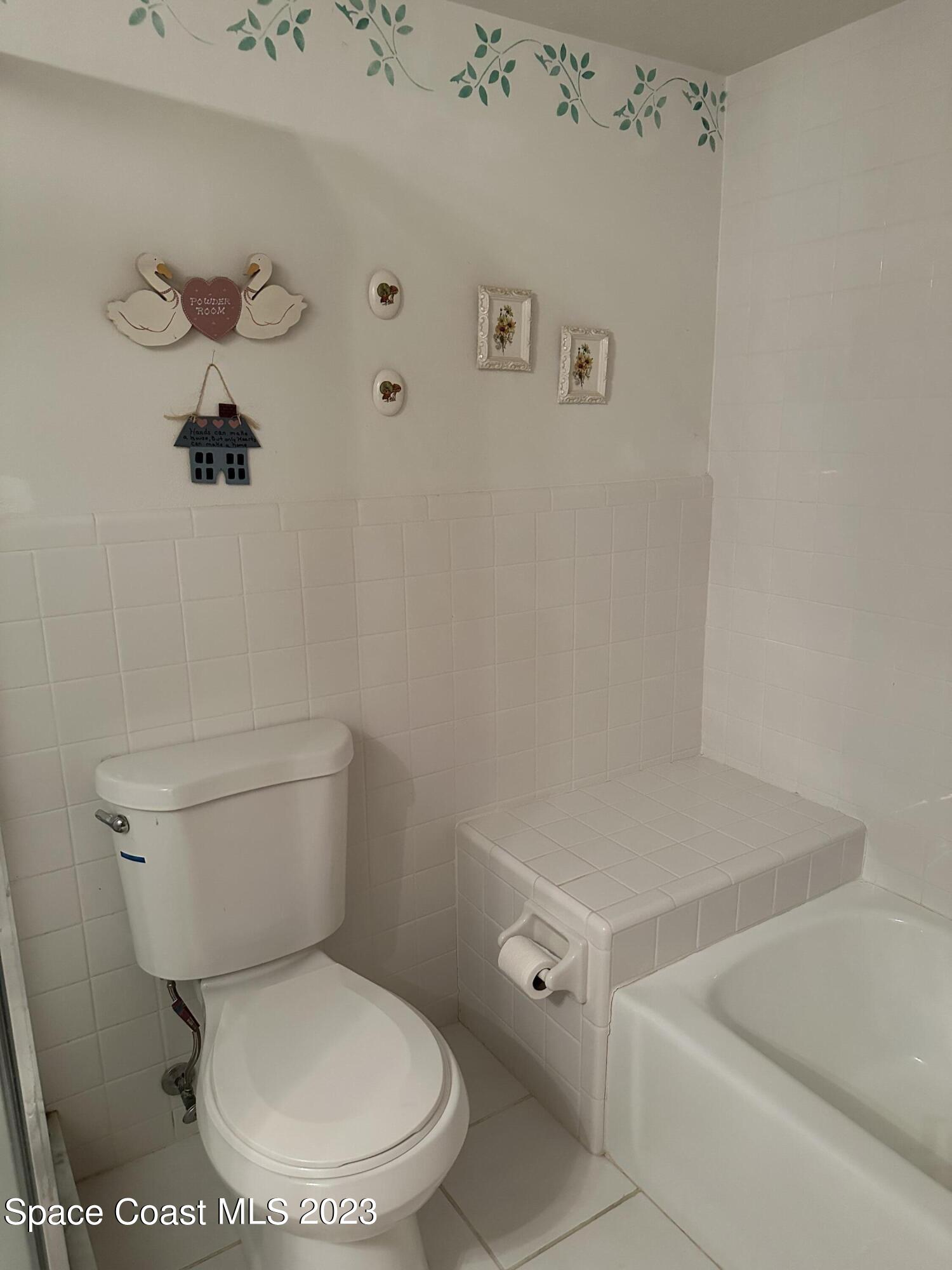 3995 Toby Avenue Malabar, FL 32950 - Photo 24 of 43 a white toilet sitting next to a bathroom sink