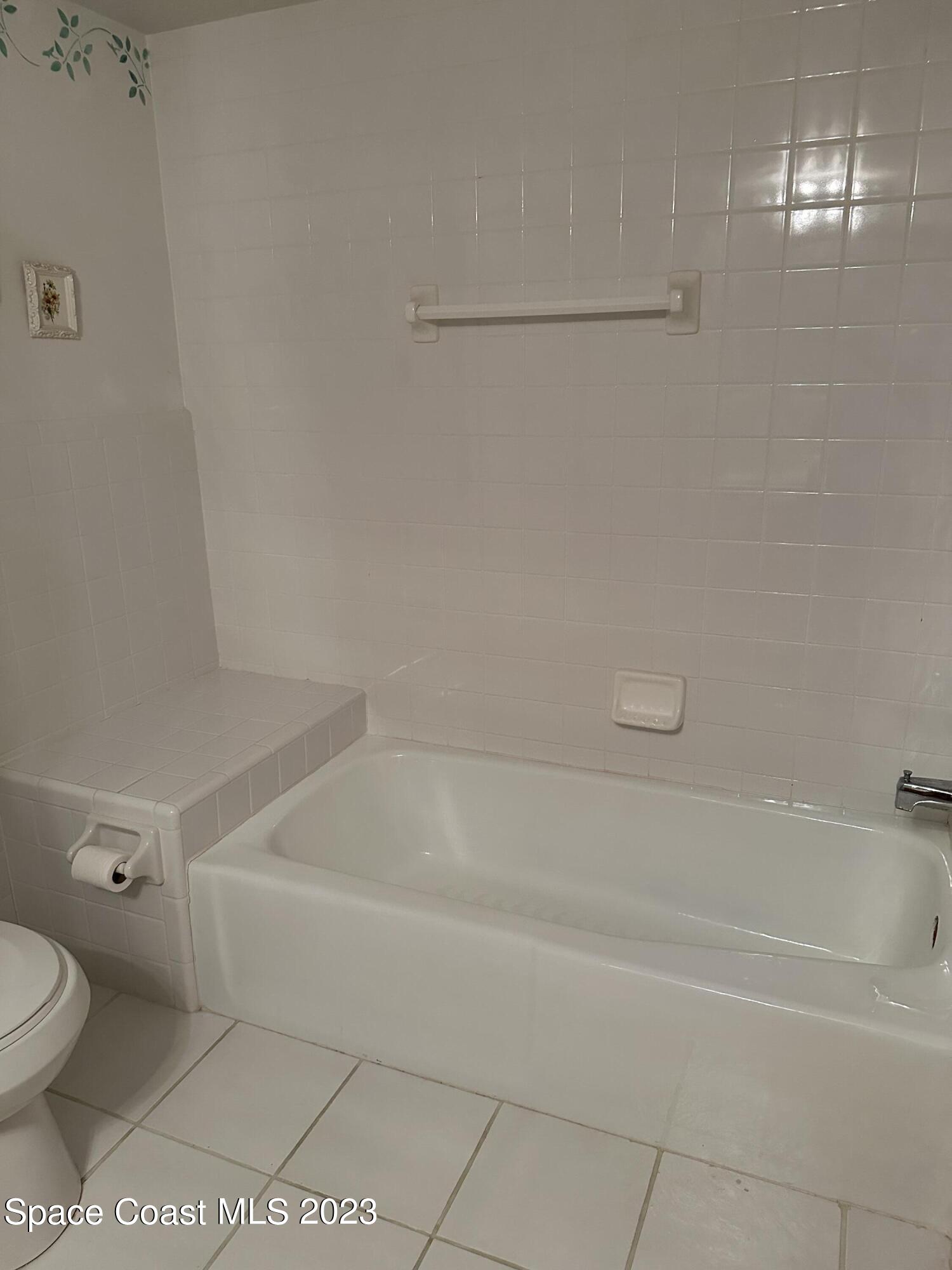 3995 Toby Avenue Malabar, FL 32950 - Photo 25 of 43 a bathroom with a toilet and a bathtub