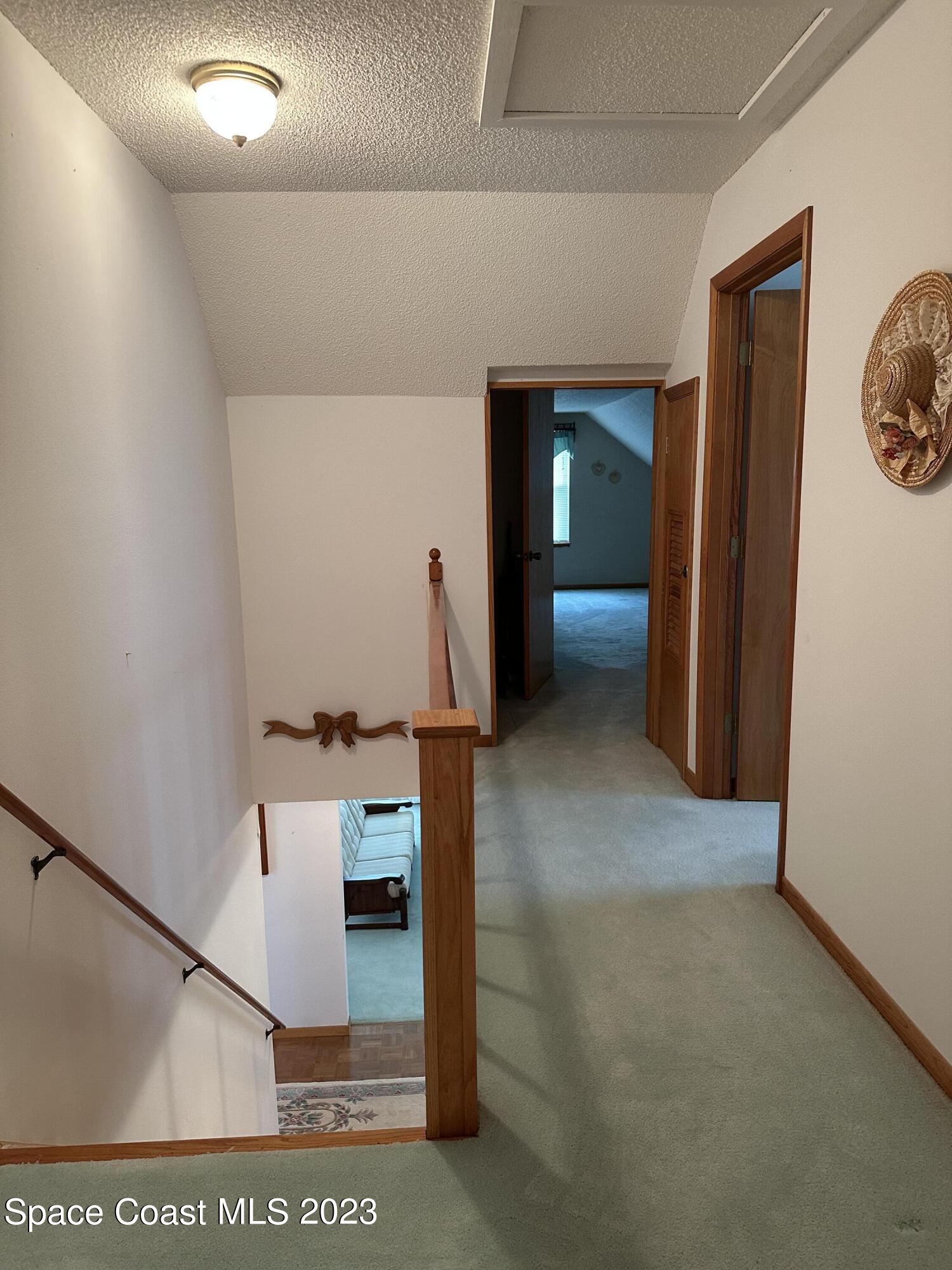 3995 Toby Avenue Malabar, FL 32950 - Photo 27 of 43 a view of a hallway with seating area
