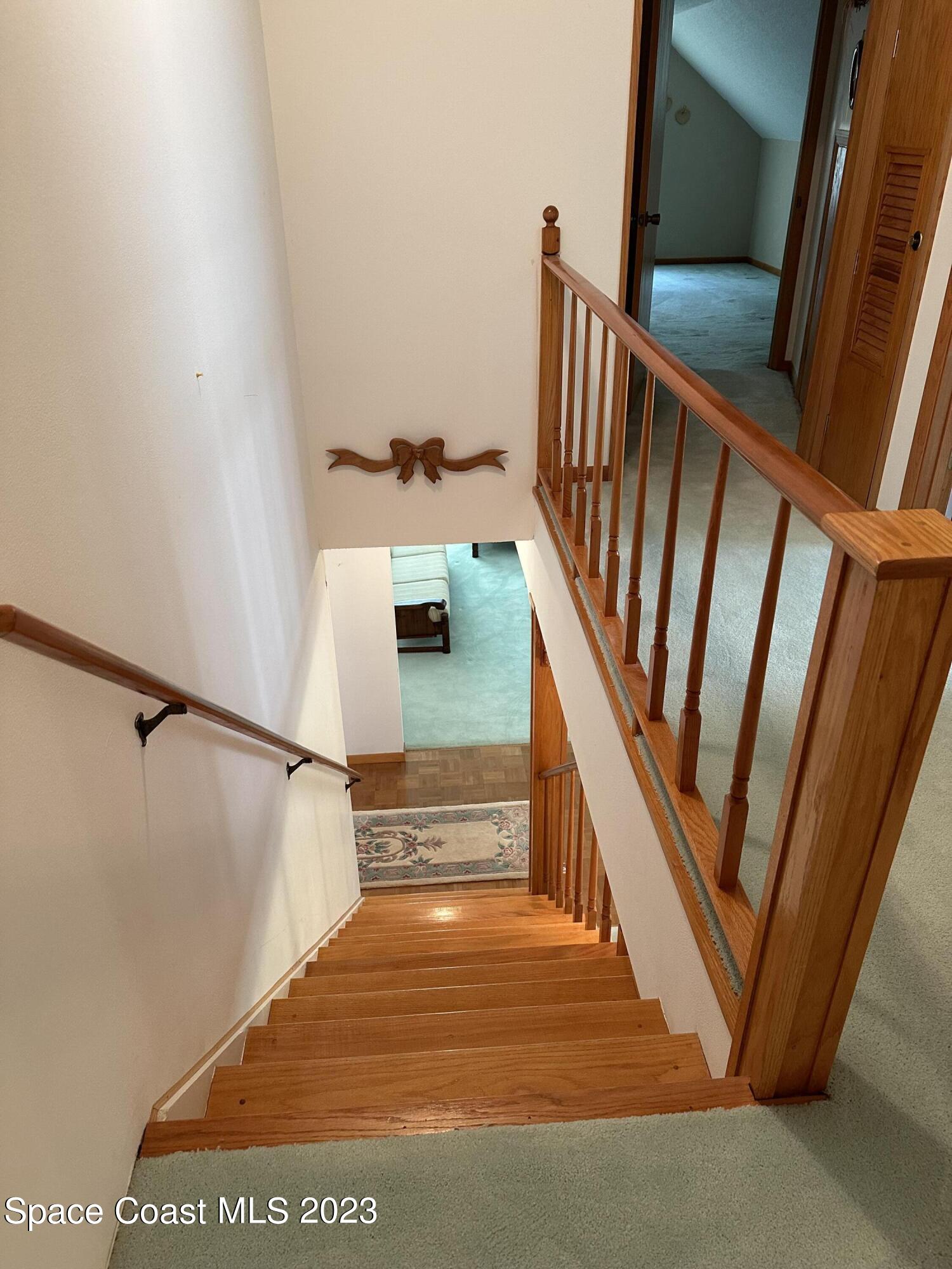3995 Toby Avenue Malabar, FL 32950 - Photo 34 of 43 a view of entryway and hall with wooden floor