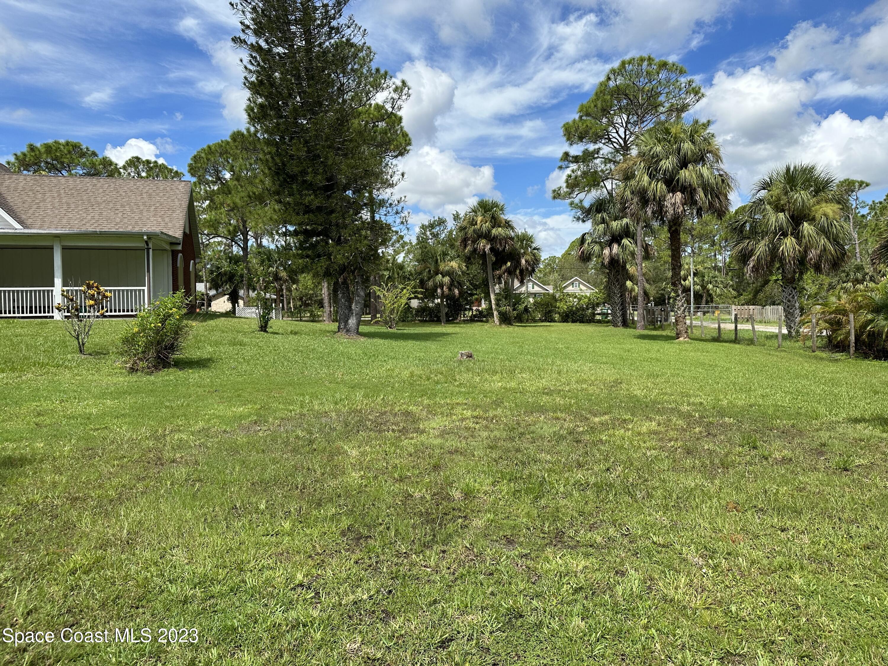 3995 Toby Avenue Malabar, FL 32950 - Photo 41 of 43 a view of a house with a big yard