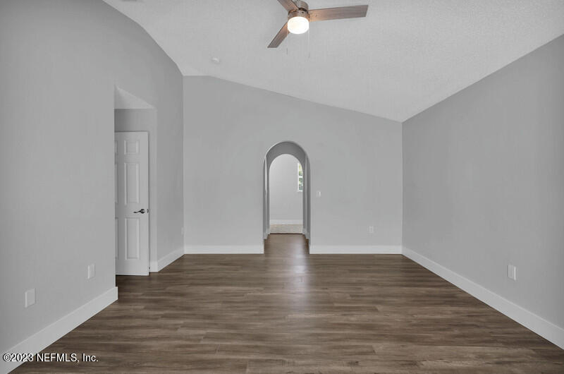 692 Largo Lane Macclenny, FL 32063 - Photo 19 of 41 a view of empty room with wooden floor