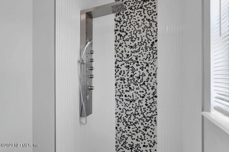 692 Largo Lane Macclenny, FL 32063 - Photo 20 of 41 a bathroom with a shower curtain