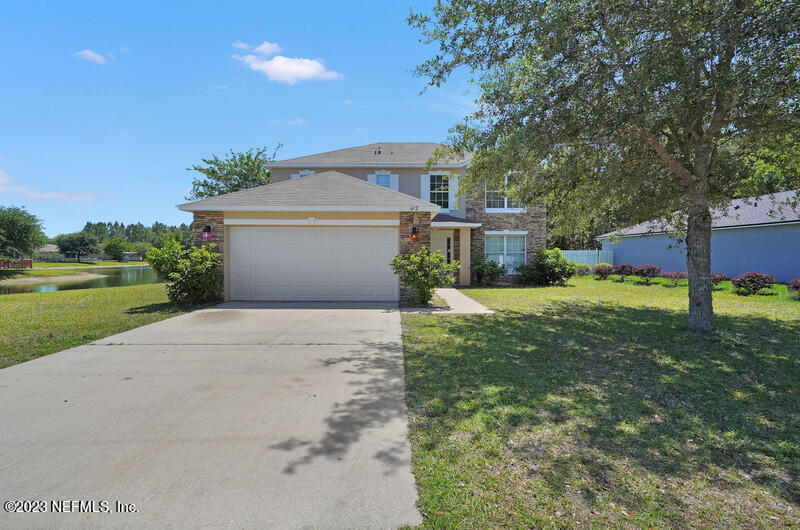 692 Largo Lane Macclenny, FL 32063 - Photo 2 of 41 a front view of a house with garden