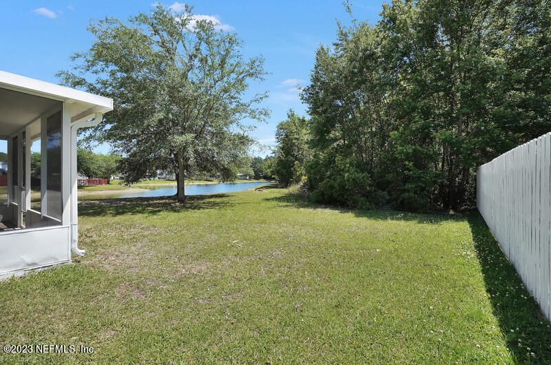 692 Largo Lane Macclenny, FL 32063 - Photo 22 of 41 a view of outdoor space with deck and yard