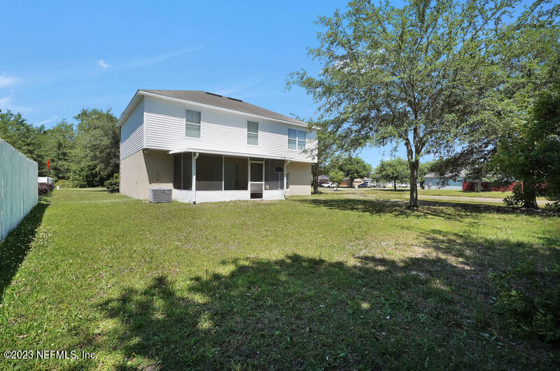 692 Largo Lane Macclenny, FL 32063 - Photo 23 of 41 a front view of a house with a yard