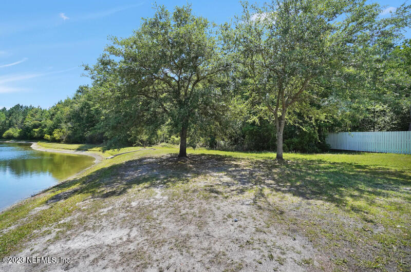 692 Largo Lane Macclenny, FL 32063 - Photo 25 of 41 a view of a yard with a tree