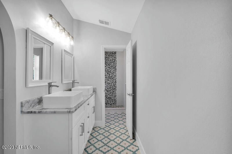 692 Largo Lane Macclenny, FL 32063 - Photo 31 of 41 a bathroom with a sink and a mirror