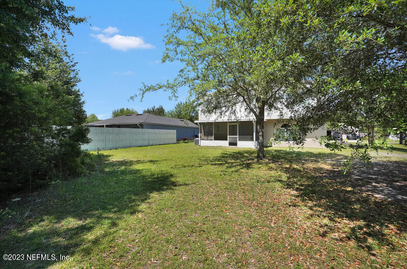 692 Largo Lane Macclenny, FL 32063 - Photo 36 of 41 a view of a house with a yard