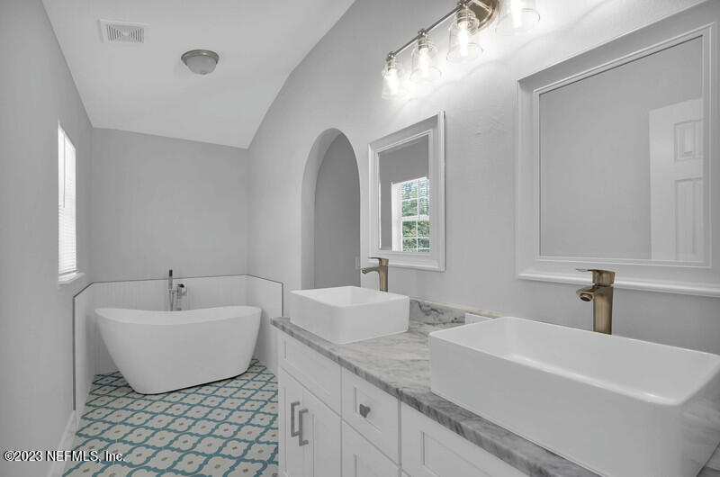 692 Largo Lane Macclenny, FL 32063 - Photo 6 of 41 a bathroom with a sink and a bathtub
