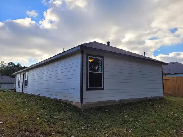 a backyard of a house with lots of green space