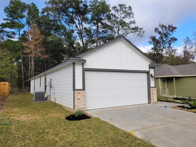 a view of garage and yard