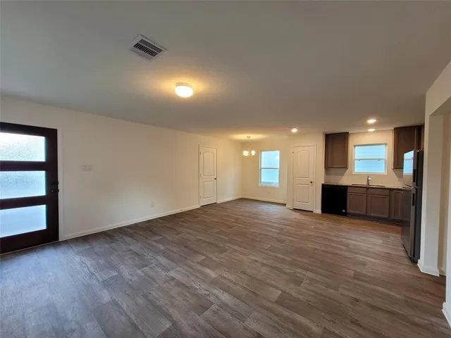 a view of a kitchen with a sink and a window