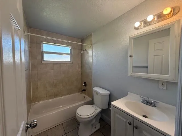 a bathroom with a toilet a sink and bathtub