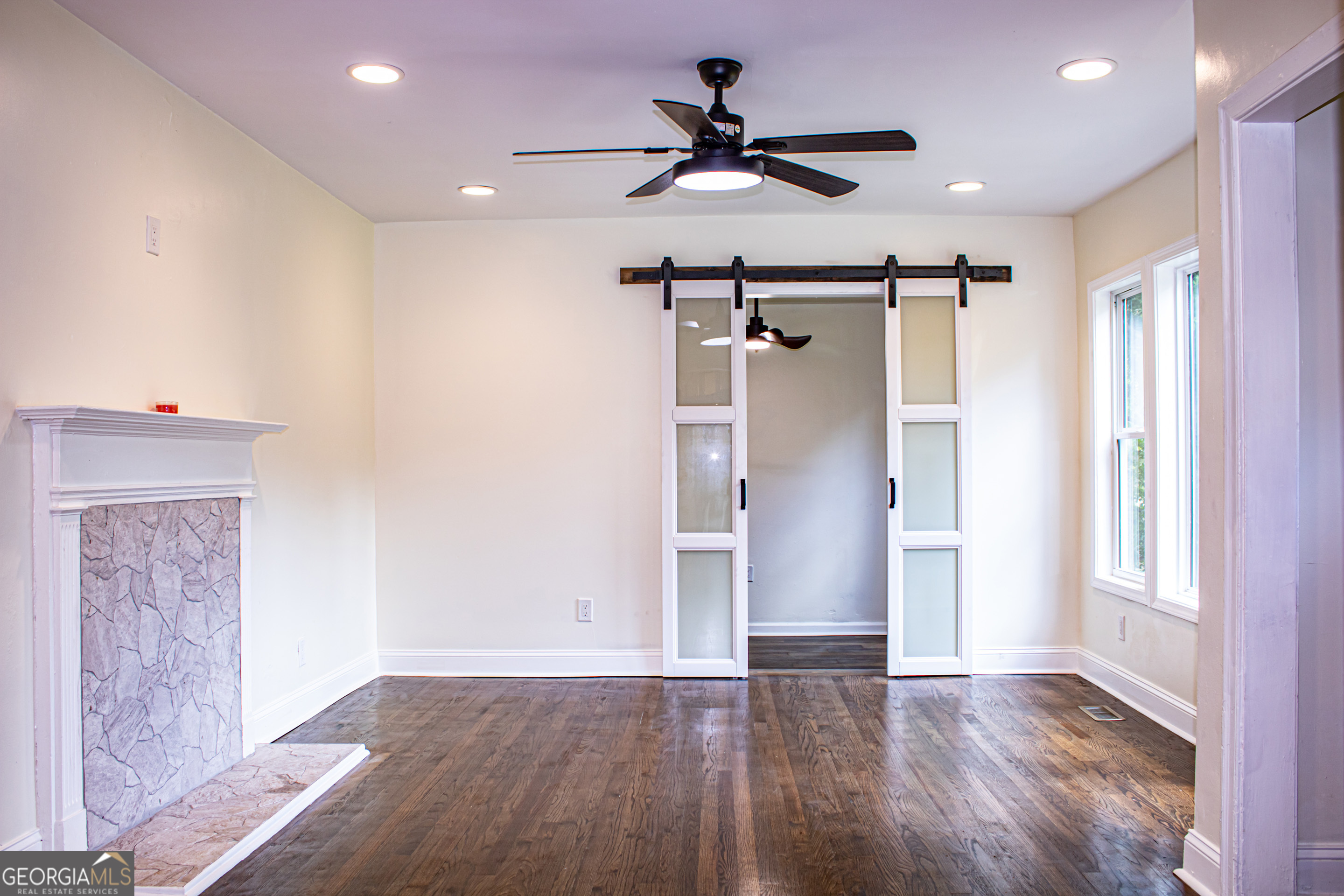 773 Fayetteville Road Southeast Atlanta, GA 30316 - Photo 4 of 17 a view of empty room with wooden floor and fan