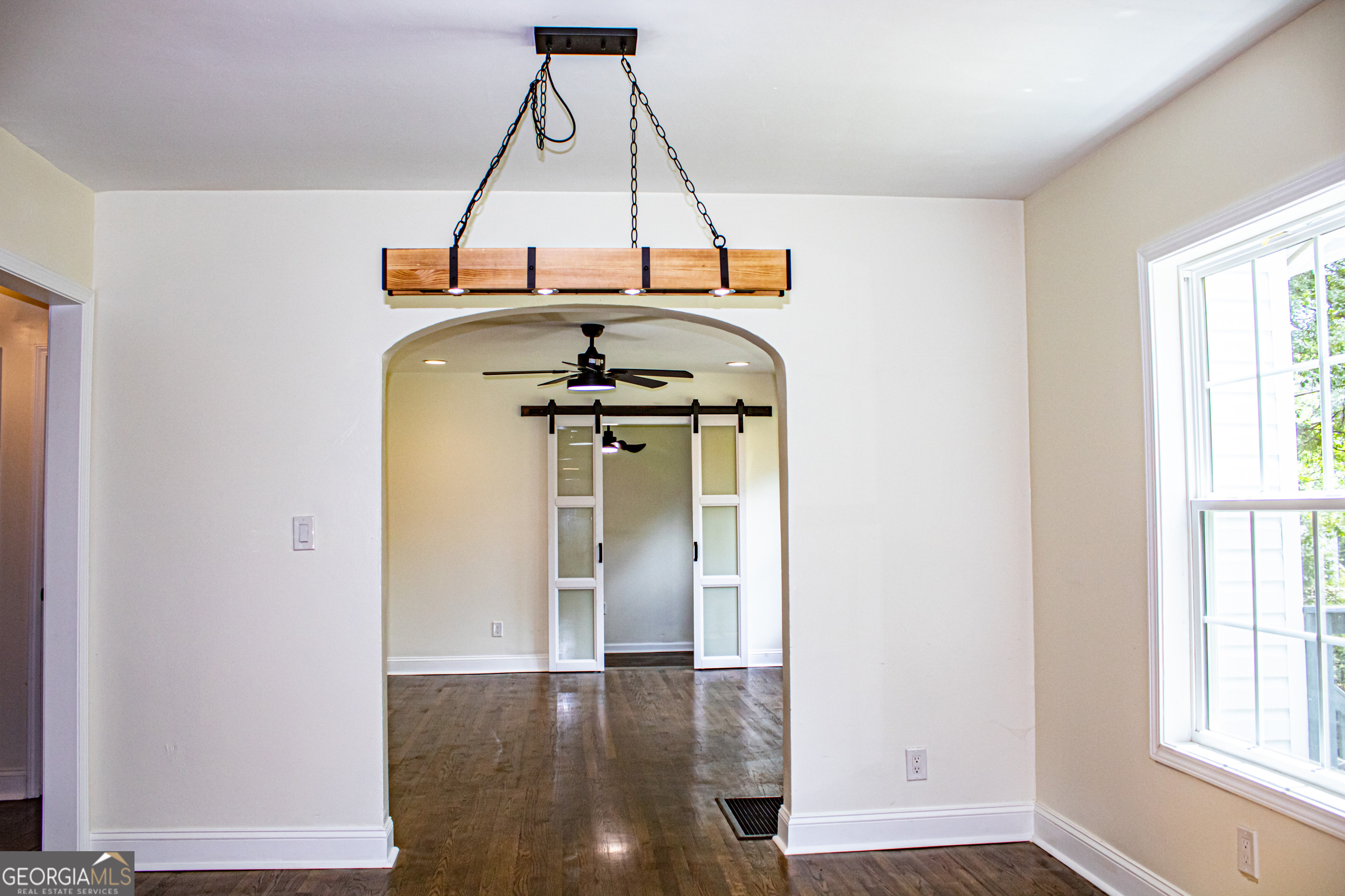 773 Fayetteville Road Southeast Atlanta, GA 30316 - Photo 7 of 17 a room with wooden floor and window