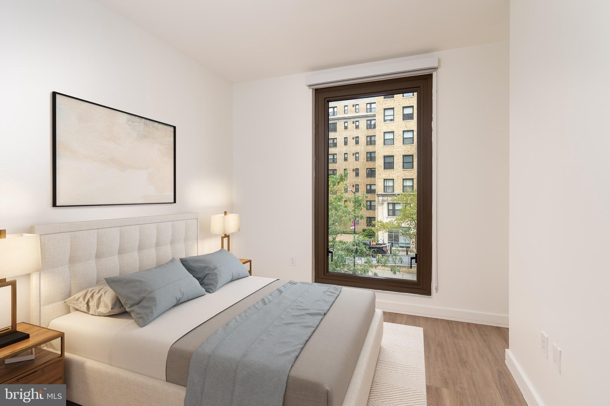 1630 Columbia Road Northwest, Unit 316 Washington, DC 20009 - Photo 2 of 20 a bedroom with a bed and a window