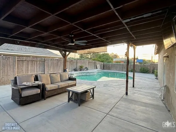 a outdoor living space with patio furniture and a garden