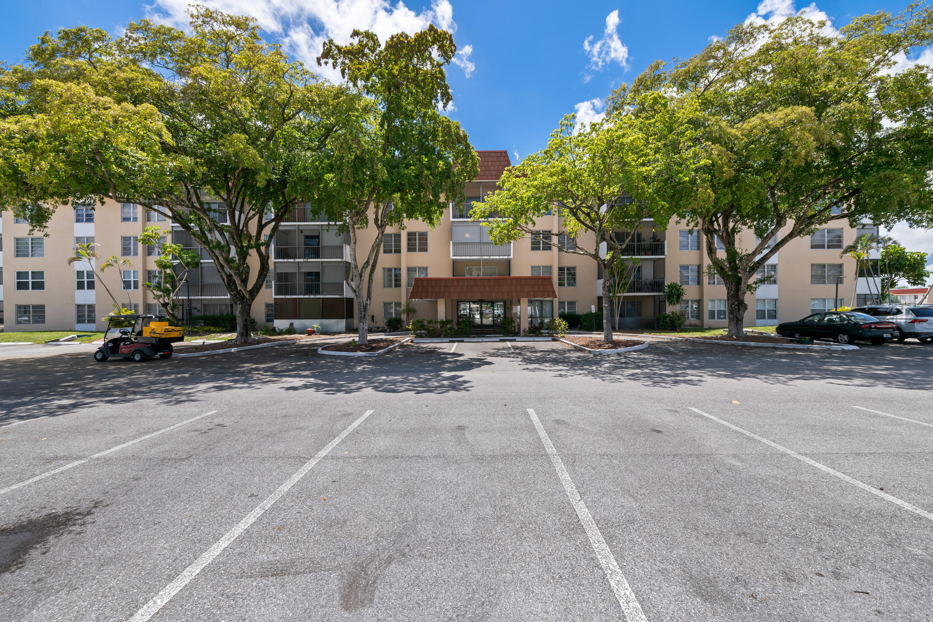 4156 Inverrary Drive, Unit 210 Lauderhill, FL 33319 - Photo 4 of 27 a view of a street with cars