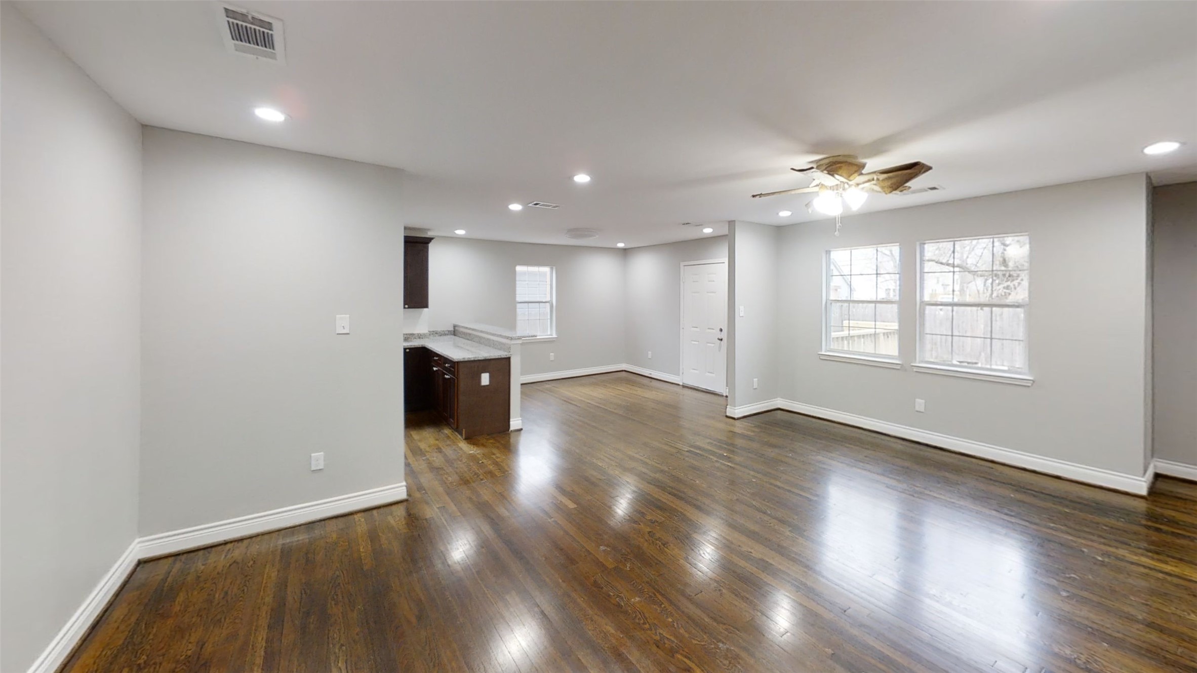 4323 Alice Street Houston, TX 77021 - Photo 3 of 11 wooden floor in an empty room with a window