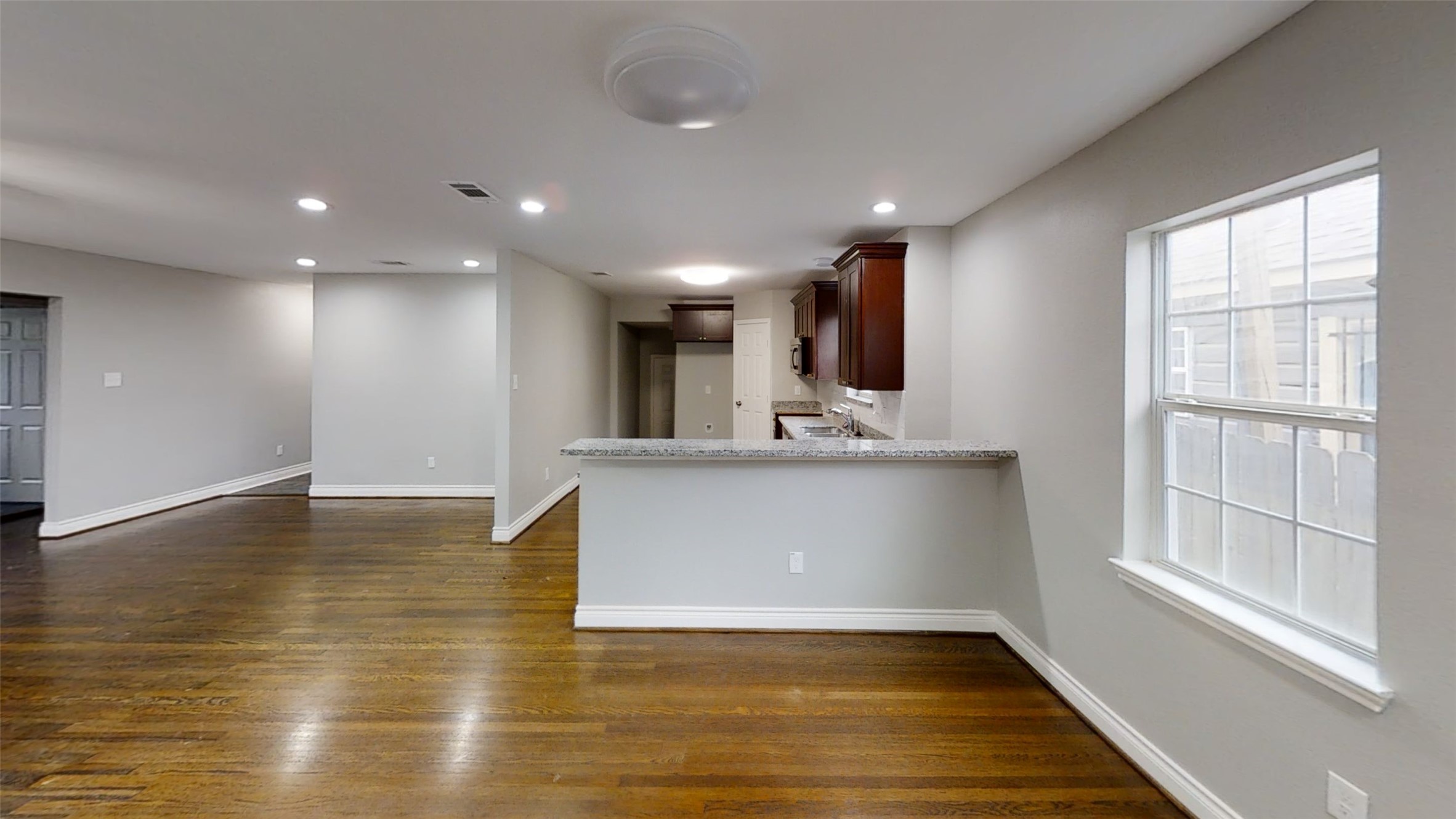 4323 Alice Street Houston, TX 77021 - Photo 4 of 11 a view of kitchen with cabinets and wooden floor